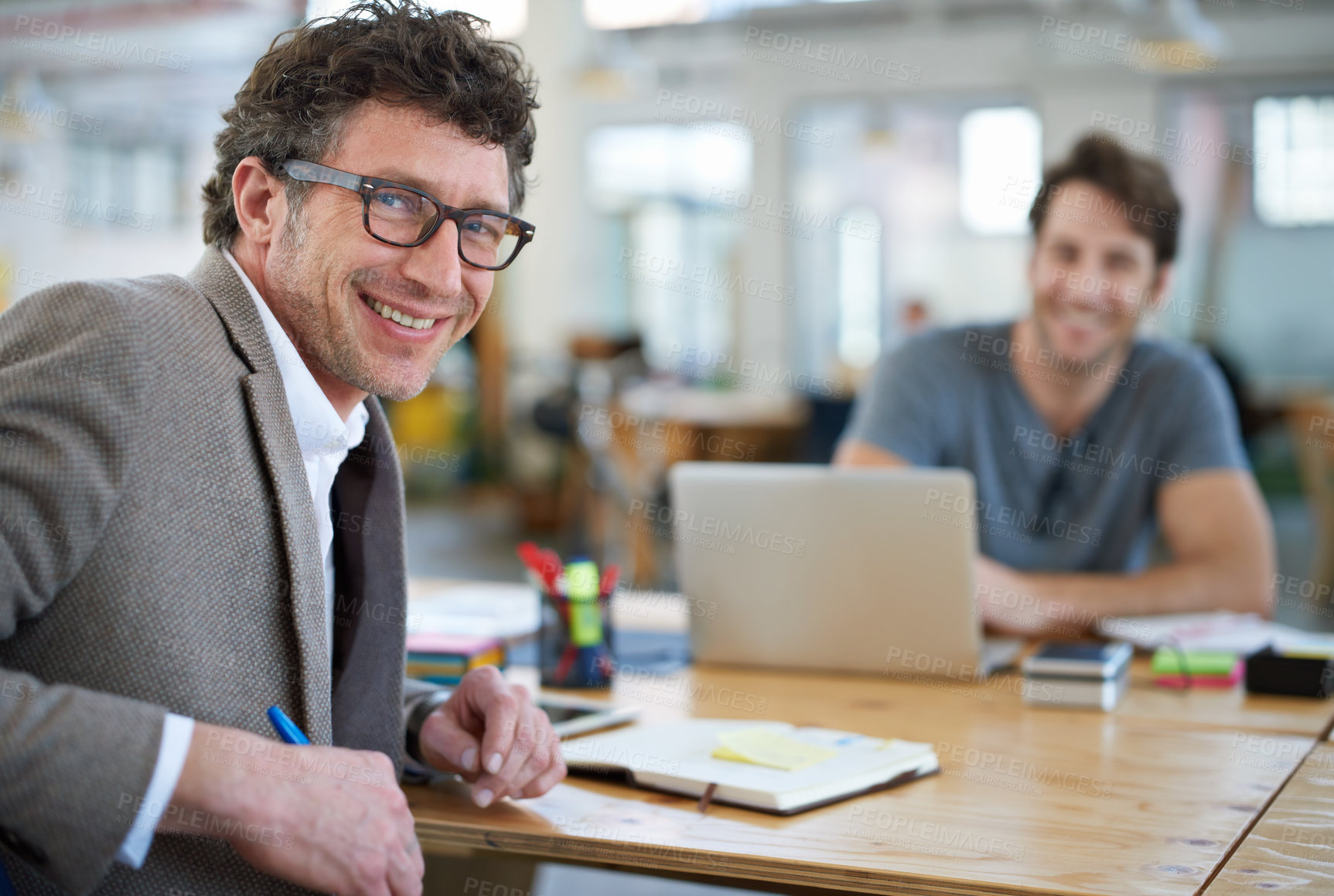 Buy stock photo Creative man and happy portrait of coworking in office with team and planning project with notes on desk. Mature, employee and productivity in collaboration, cooperation or writing ideas in schedule