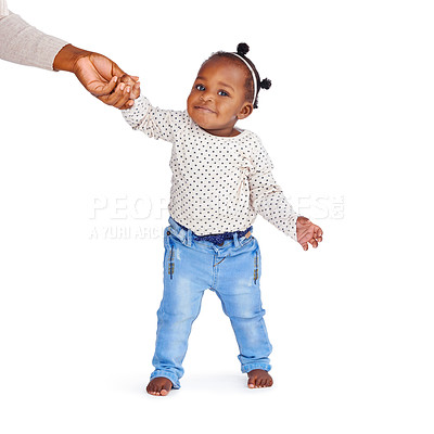Buy stock photo Baby, parent and help walking in studio for fashion, jeans or clothing or development. Girl, isolated on backdrop or standing support with person for trend, holding hands or smile or kid in Brazil