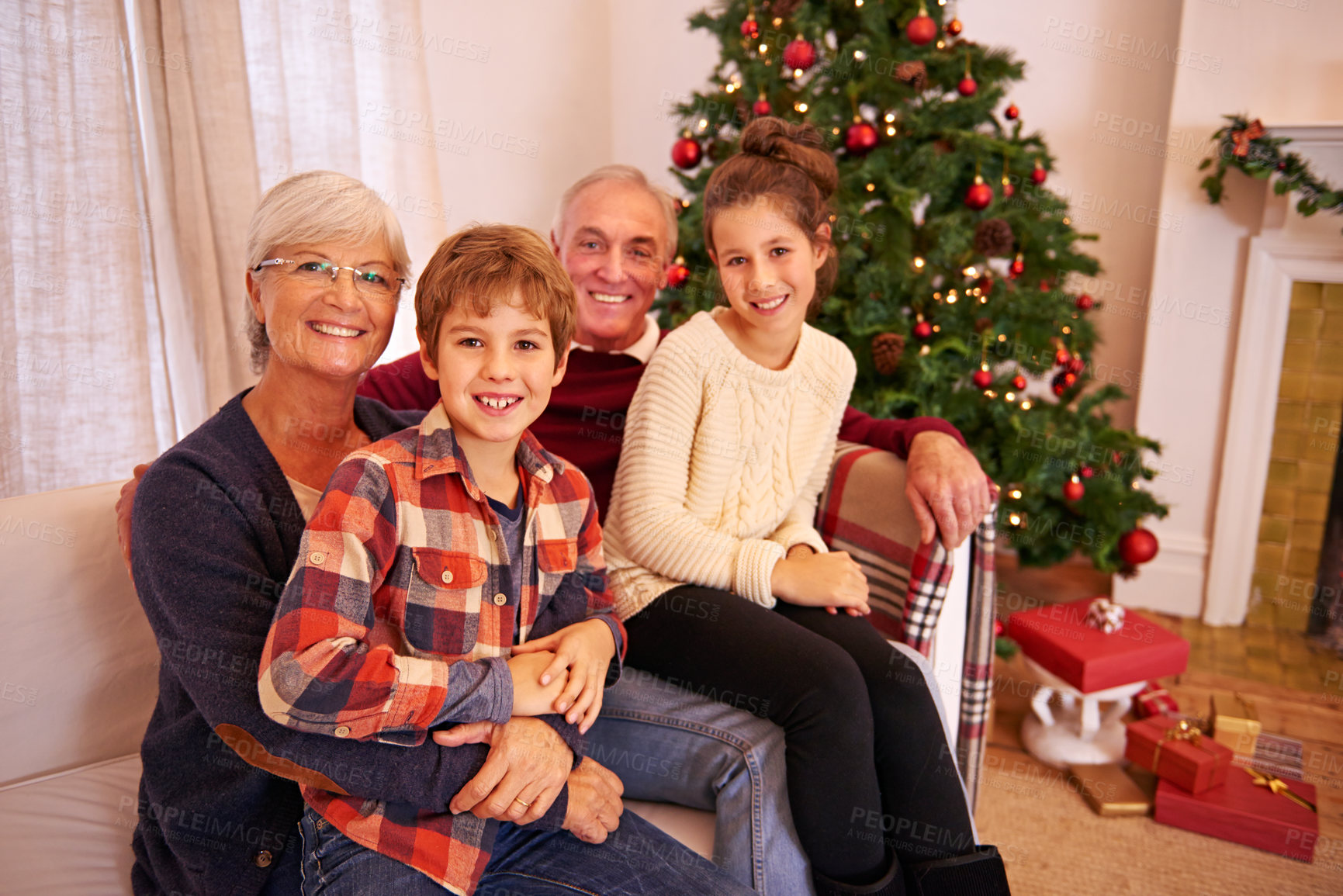 Buy stock photo Christmas, senior couple and couch for grandchildren, happiness or relax for festive season in lounge. Xmas, love or portrait for elderly man, mature woman or grandkids or happy with smile or content