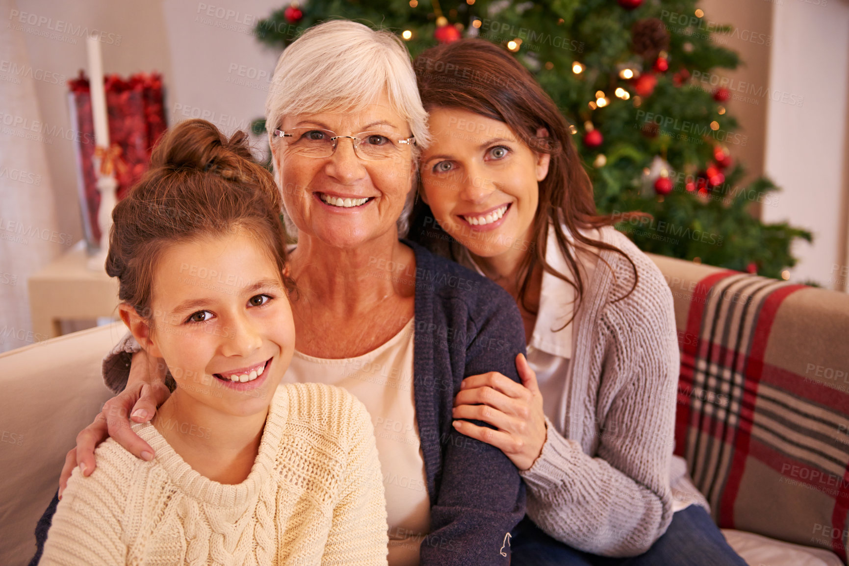 Buy stock photo Christmas, family and child portrait with grandmother for love, happiness or relax together on couch. Xmas, grandparent and girl bonding, loving and festive being happy, joyful and on sofa in lounge
