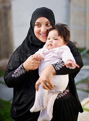 Buy stock photo Islamic mom, girl baby and celebrate Eid in backyard of family home, together and relationship with child. Muslim female person, infant and bonding for development and Ramadan in the garden. 