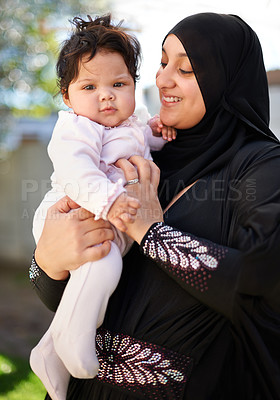 Buy stock photo Baby girl, hug and Muslim mom in hijab outside house for religious celebration, ramadan and young child at home. Islamic female, Arab infant and bonding together in backyard of family dwelling. 