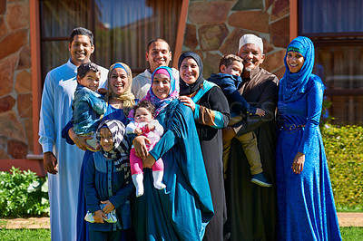 Buy stock photo Portrait of a happy muslim family standing together in front of their house