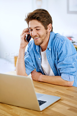 Buy stock photo Shot of a young entrepreneur talking on a phone