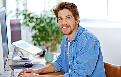 Buy stock photo Shot of a young man working in a home office