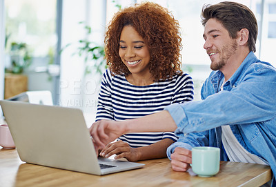 Buy stock photo Shot of two coworkers working together at their desks