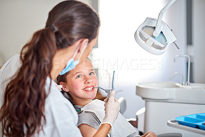 Buy stock photo Shot of a young girl at the dentist