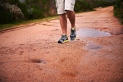 Buy stock photo Legs, shoes and walking on ground in nature, fitness and trekking or hiking, wellness and closeup. Road, training and exercise or workout in park, sports and travel for peace, journey and outdoor