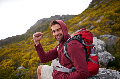 Buy stock photo Mountain, man and celebration for hiking in portrait, peak and journey with success and freedom outdoor. Trekking, rock climbing and horizon with fist pump for achievement, travel and adventure