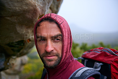 Buy stock photo Portrait, rock and man hiking in mountain, nature and backpack for holiday, wellness and health. Travel, trekking and male person with smile, happiness and adventure of guy in trip for camping