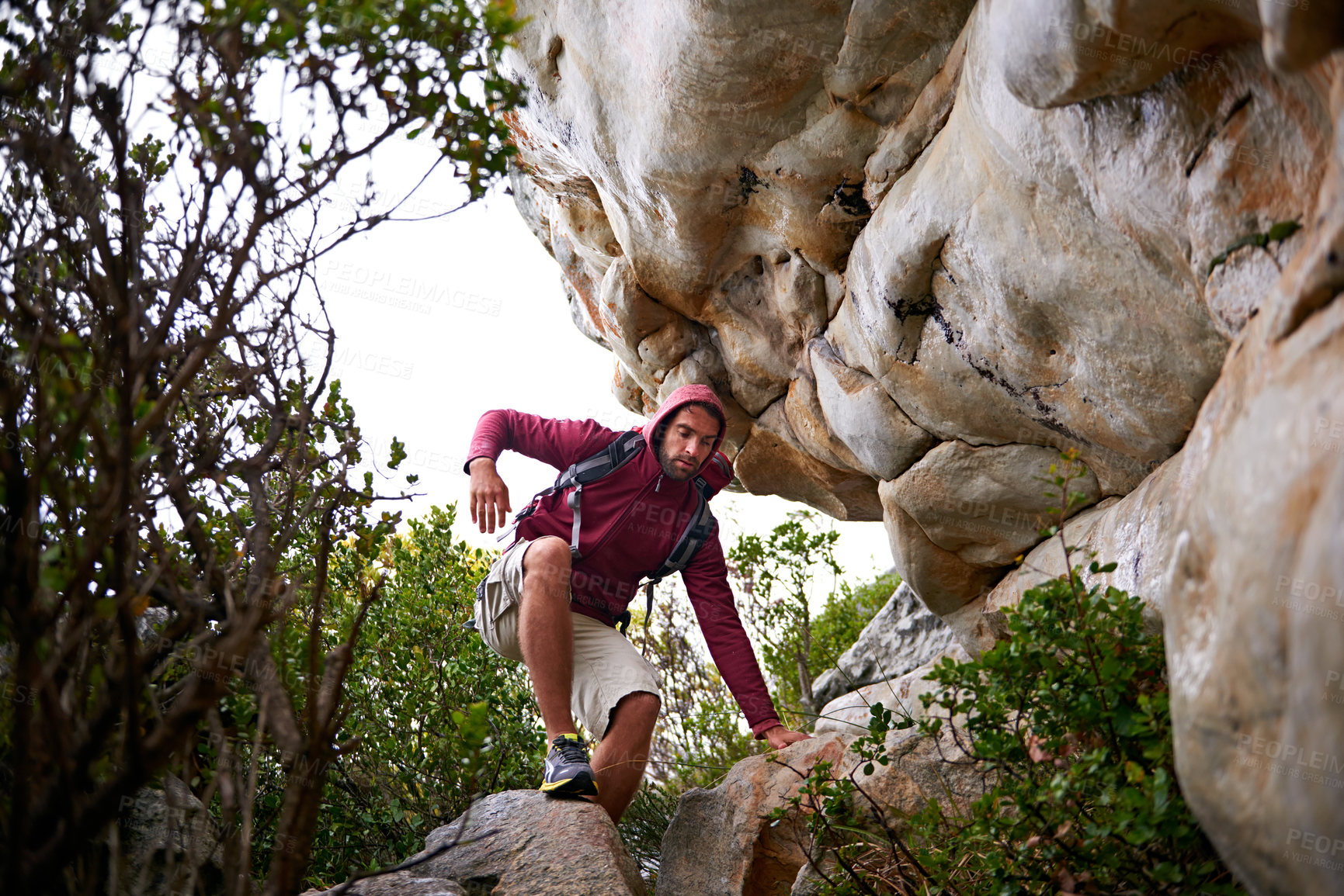 Buy stock photo Man, mountain climbing and exercise for adventure outdoor, freedom and journey with travel, focus and strong. Determination, concentration and trekking with challenge, peak and rocks on rough terrain