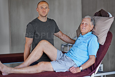 Buy stock photo Male, physical therapist and working with senior man and smile in workplace, recovery or support on table. Retired man and physio for assistance and wellness in consulting office, massage or care