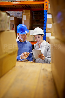 Buy stock photo Inventory, stock and employees using tablet in distribution warehouse for shipping company with inspection. Man, woman and hard hats in factory for wholesale supplier in freight, retail and industry.