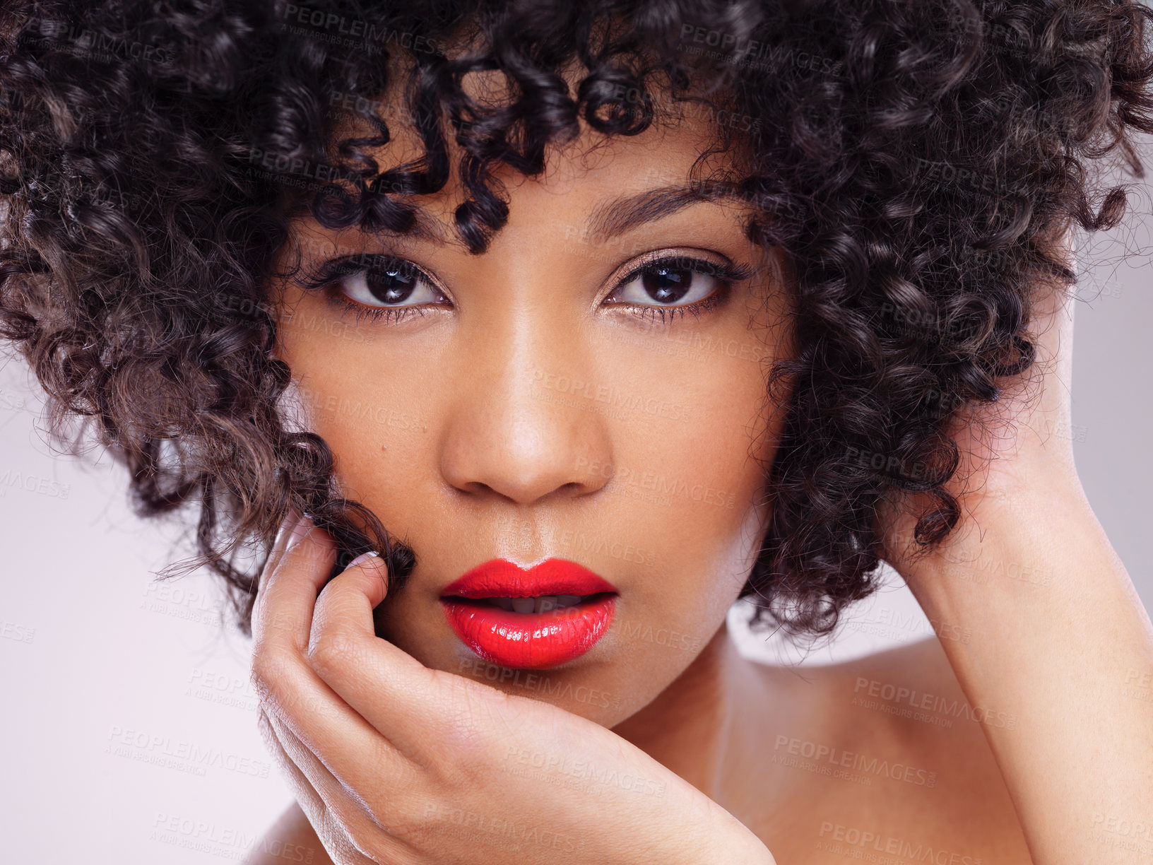 Buy stock photo Studio shot of a beautiful young woman against a gray background