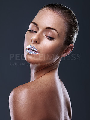 Buy stock photo Woman, makeup and sparkling lips in studio for cosmetic beauty on black background or glamour, skincare or mockup space. Female person, mouth and glow treatment for self care, confident or rhinestone
