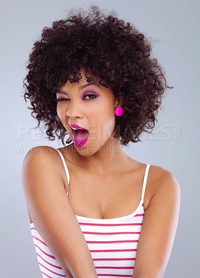 Buy stock photo Studio, portrait and wink for woman, beauty and makeup on gray background. Lipstick, cosmetic and afro with expression for African female person model, cosmetology or skincare or natural aesthetic