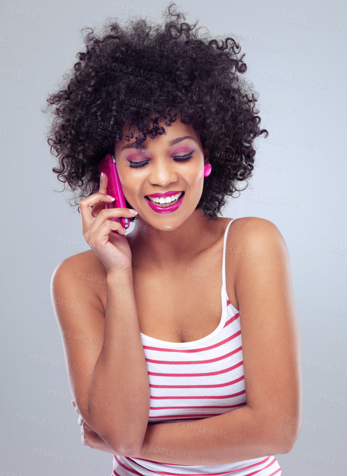 Buy stock photo Studio, phone call and smile for female person, cellphone and pink makeup on white background. Laugh, conversation and talking on smartphone with afro woman model, communication and technology