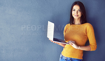 Buy stock photo Woman, laptop and mockup for fashion, style and trend in clothes in portrait and smile for ecommerce. Female person, confidence and happy for tech, research and social media blog by wall space 