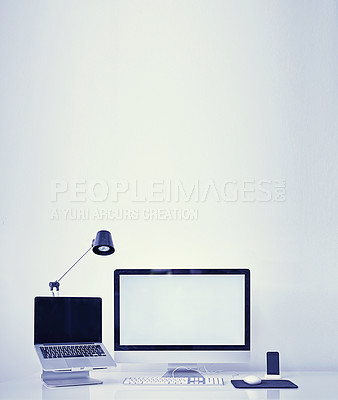 Buy stock photo Computer, technology and workspace with mockup screen of equipment or interior on a gray studio background. Empty room with laptop, pc or desktop display of workstation, tools or tech for design