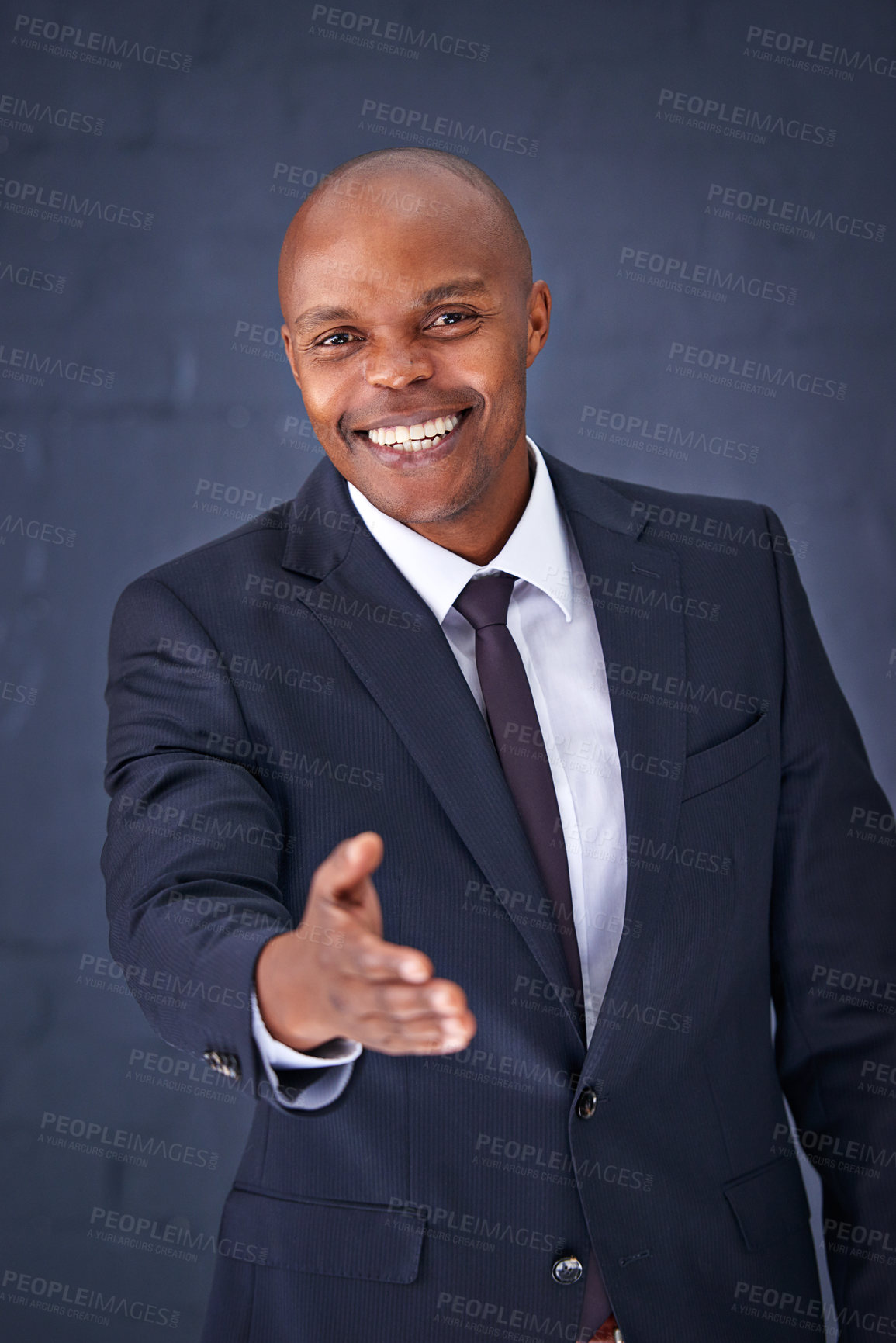 Buy stock photo Happy, portrait and black man with handshake in business, deal or agreement on a gray studio background. African male person, businessman or employee with smile for shaking hands, meeting or greeting