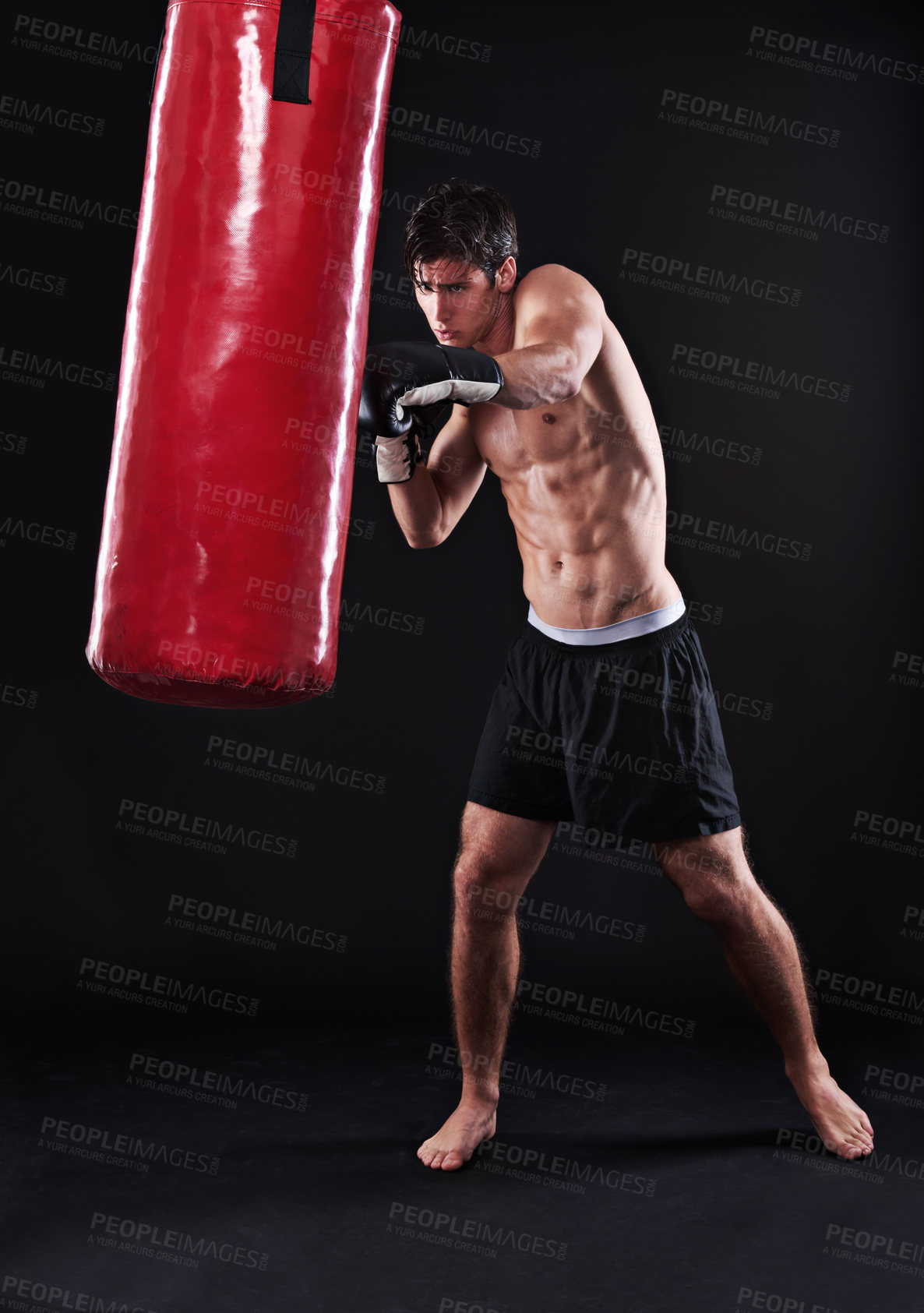 Buy stock photo Man, gloves and boxing bag for exercise practice or cardio workout for health, fighter or black background. Male person, punch and martial arts training in studio on mockup for fitness, gym or fist
