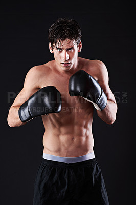 Buy stock photo Man, portrait and boxing gloves in studio for workout fight or martial arts training or performance, black background or challenge. Male person, face and sports exercise or fitness, athlete or mockup