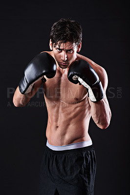 Buy stock photo Man, portrait and boxing gloves in studio for exercise fight or martial arts training or performance, black background or gym. Male person, face and self defence fitness for athlete, mockup or punch