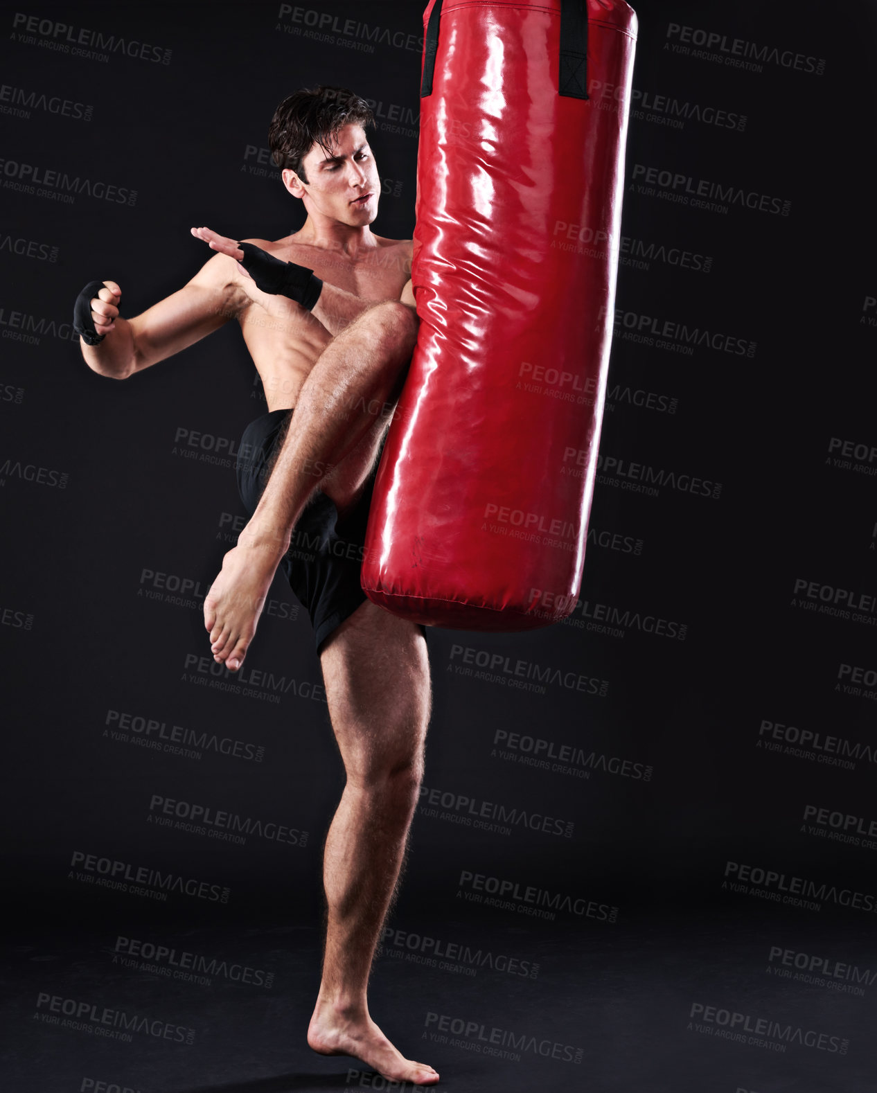 Buy stock photo Kickboxing, bag and man with training, fitness and exercise on a dark studio background. Healthy person, mockup space and model with endurance and practice with workout and wellness with challenge