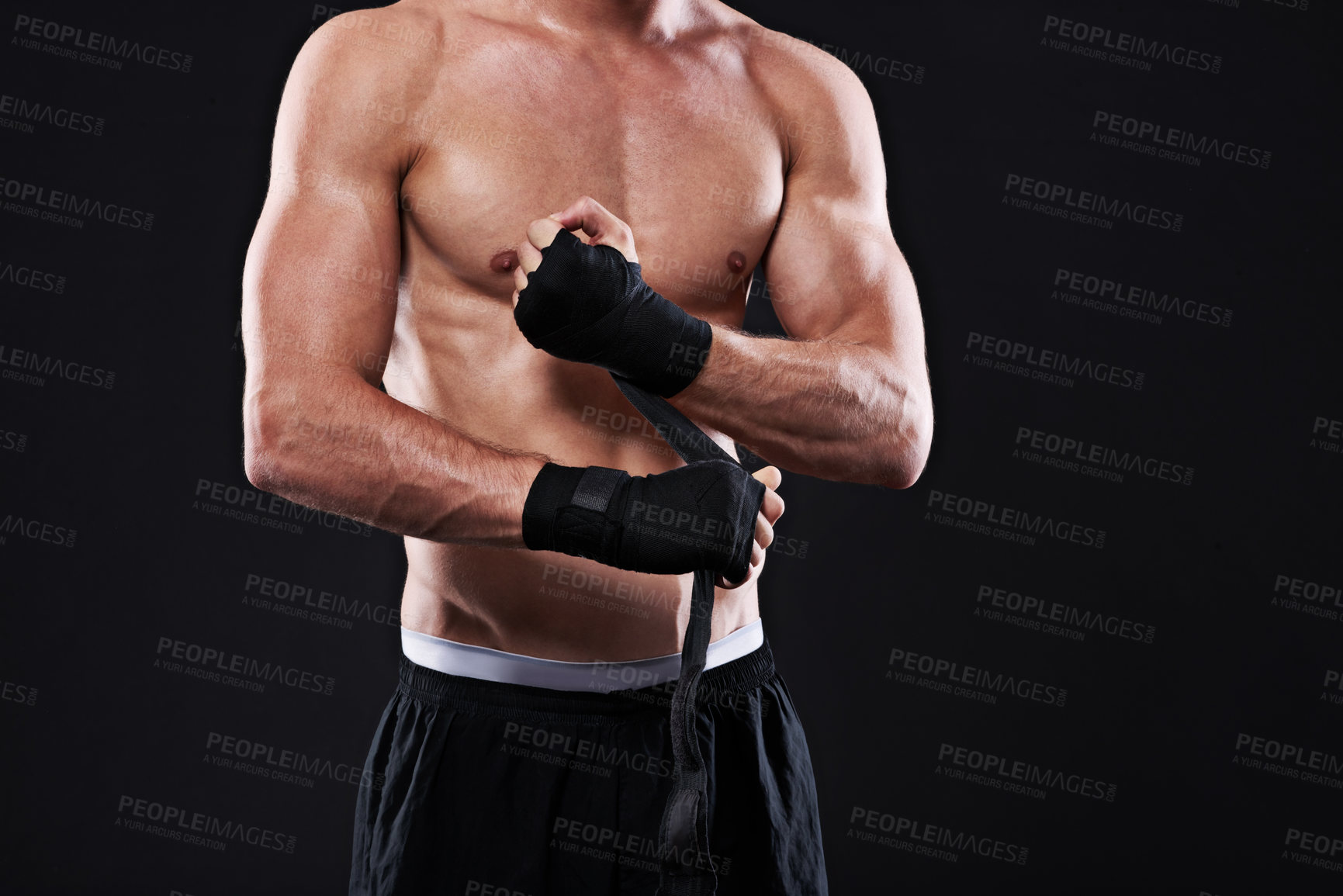 Buy stock photo Wrapping, hands and man in martial arts for boxing on black background in studio with preparation closeup. Tape, fist and ready to start training as boxer in mma or gym with fitness and mockup space