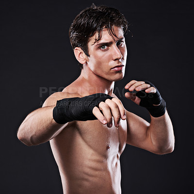 Buy stock photo Sports, boxing and portrait of man training, workout and exercise for mma fighting in studio. Serious, male athlete and  shirtless boxer, punch or strike for martial arts practice on black background