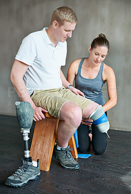 Buy stock photo Physiotherapist, rehabilitation and prosthetic leg in clinic for support, physiotherapy, and stretching. Physical therapist, help and training person with disability for wellness, therapy and health