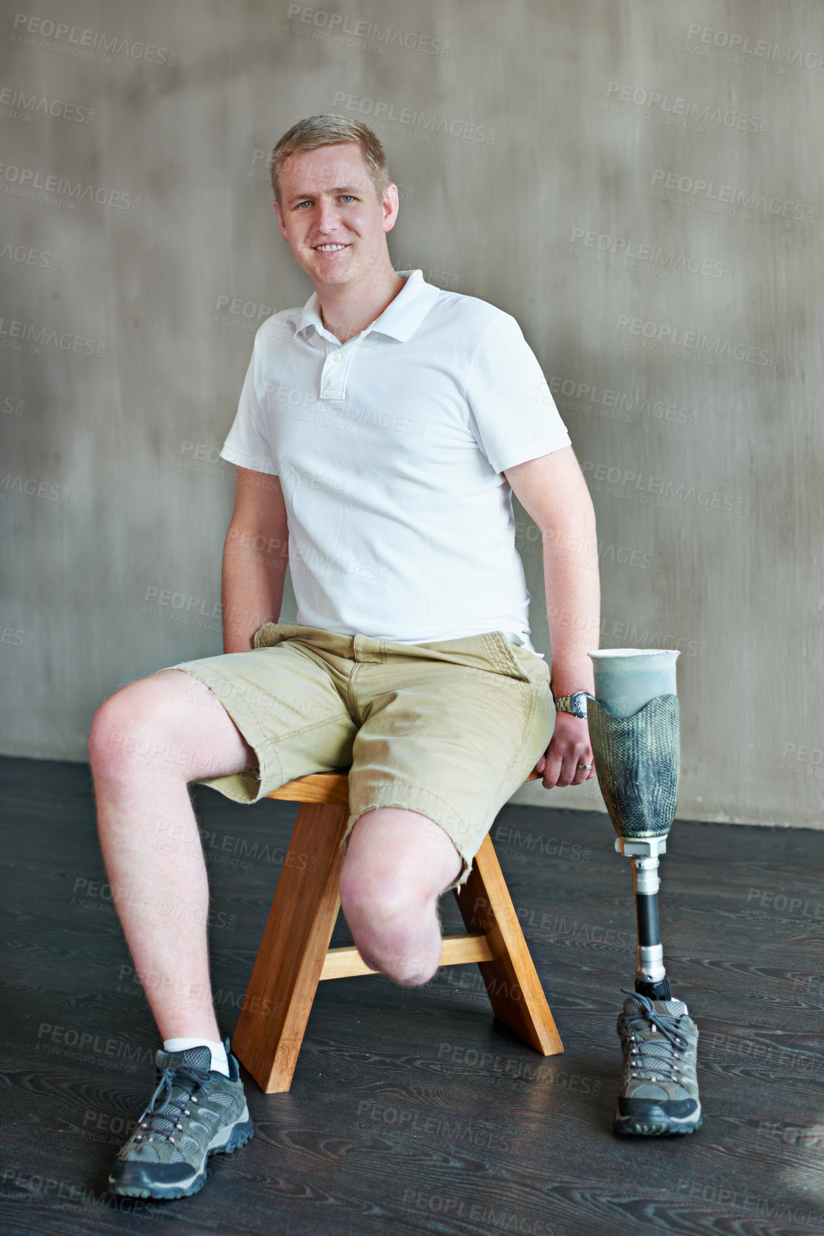 Buy stock photo Man, portrait and amputee smile with prosthetic leg in gym, sitting with residual limb for assemble. Workout, physiotherapy in wellness or male person with disability, exercise or rehabilitation