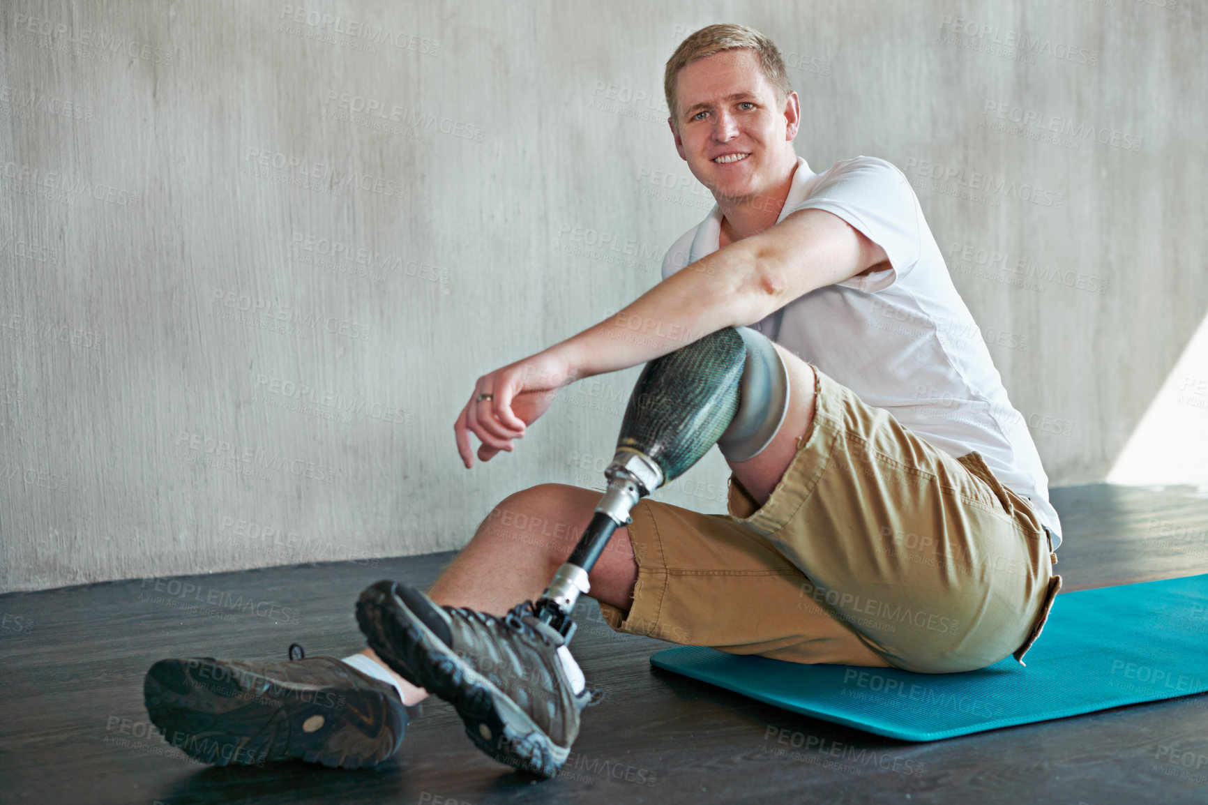 Buy stock photo Man, amputee and fitness with prosthetic legs and portrait for wellness, workout and health on floor. Person with disability and ready or on break for exercise, training and physio strength on ground