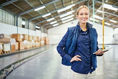 Buy stock photo Shot of a young woman working in a warehouse