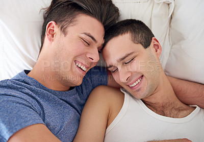 Buy stock photo Men, gay and happy couple or bed embrace in apartment resting for lgbt pride with relax love, partner or connection. Male person, queer and smile with bonding support in home together, calm or peace