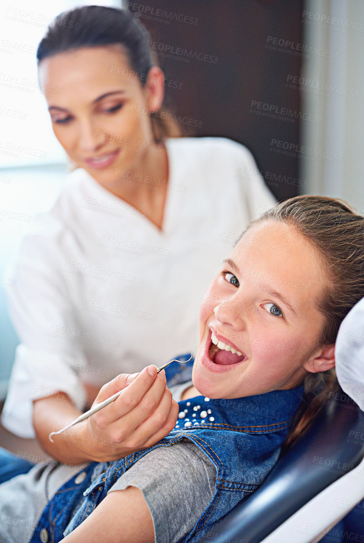 Buy stock photo Portrait, girl and dentist with kid, consultation and appointment for medical procedure and oral health. Face, professional and child with nurse and dental hygiene with care and trust with checkup