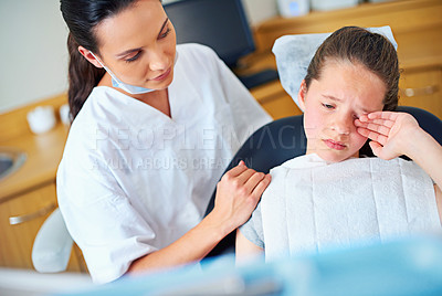 Buy stock photo Dental, fear or crying girl with dentist in toothache consultation, problem or crisis. Pediatric dentistry, comfort or kid with stress, anxiety or tears for root canal, crown or extraction phobia 