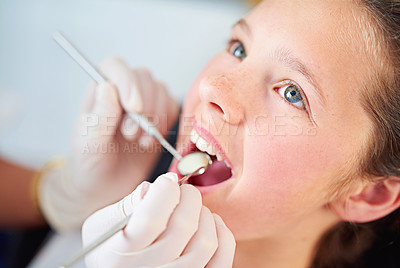 Buy stock photo Young, child and visit dentist with teeth, mirror and mouth for medical dental hygiene consult at hospital. Girl, patient and   orthodontist for appointment with tools for treatment of healthy gums
