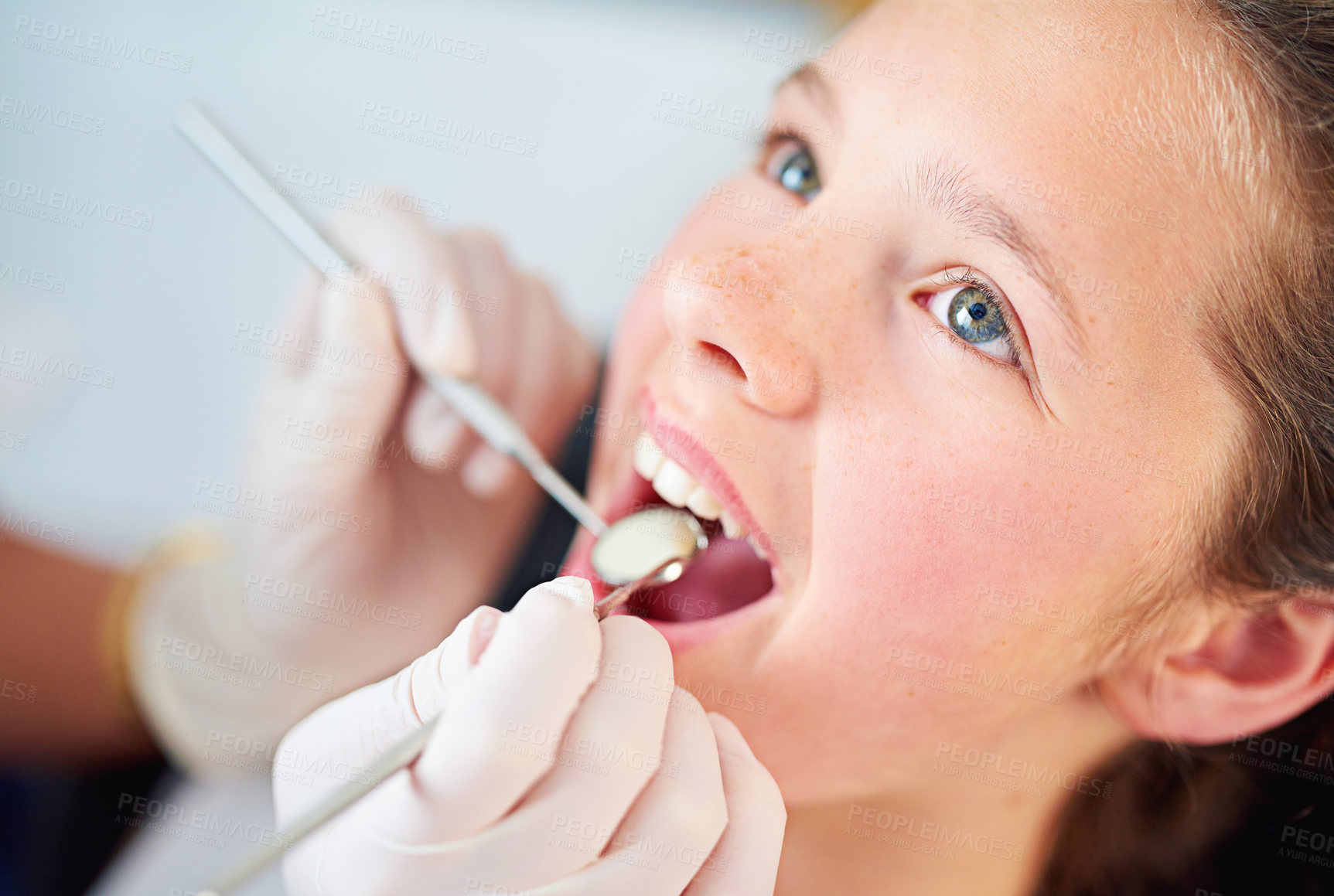 Buy stock photo Young, child and visit dentist with teeth, mirror and mouth for medical dental hygiene consult at hospital. Girl, patient and   orthodontist for appointment with tools for treatment of healthy gums