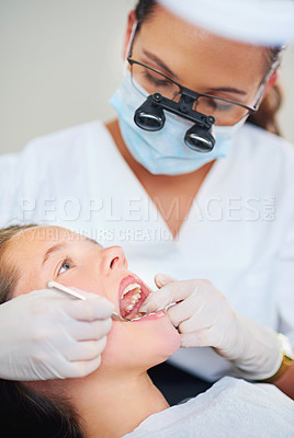 Buy stock photo Girl, child and tool for inspection at dentist for healthcare with dental mirror, consultation and checkup for oral health. Magnifying glass, kid and glove hand for teeth cleaning and medical care