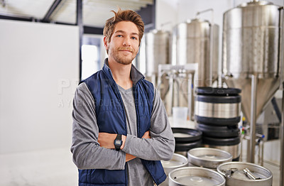 Buy stock photo Brewery, man and portrait with arms crossed in factory with confidence, pride and container machine for manufacturing. Industrial, worker and smile in distillery with tank for brewing in warehouse