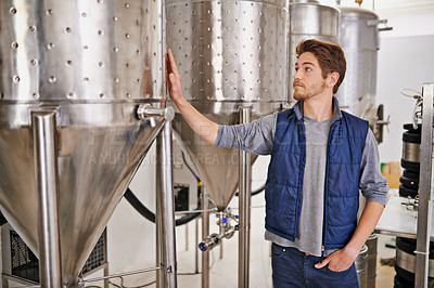 Buy stock photo Beer, production and man with steel in factory or distillery for winery, alcohol and drink manufacturing. Worker, winemaker or vintner check container, metal and fermentation vessel for brewery 