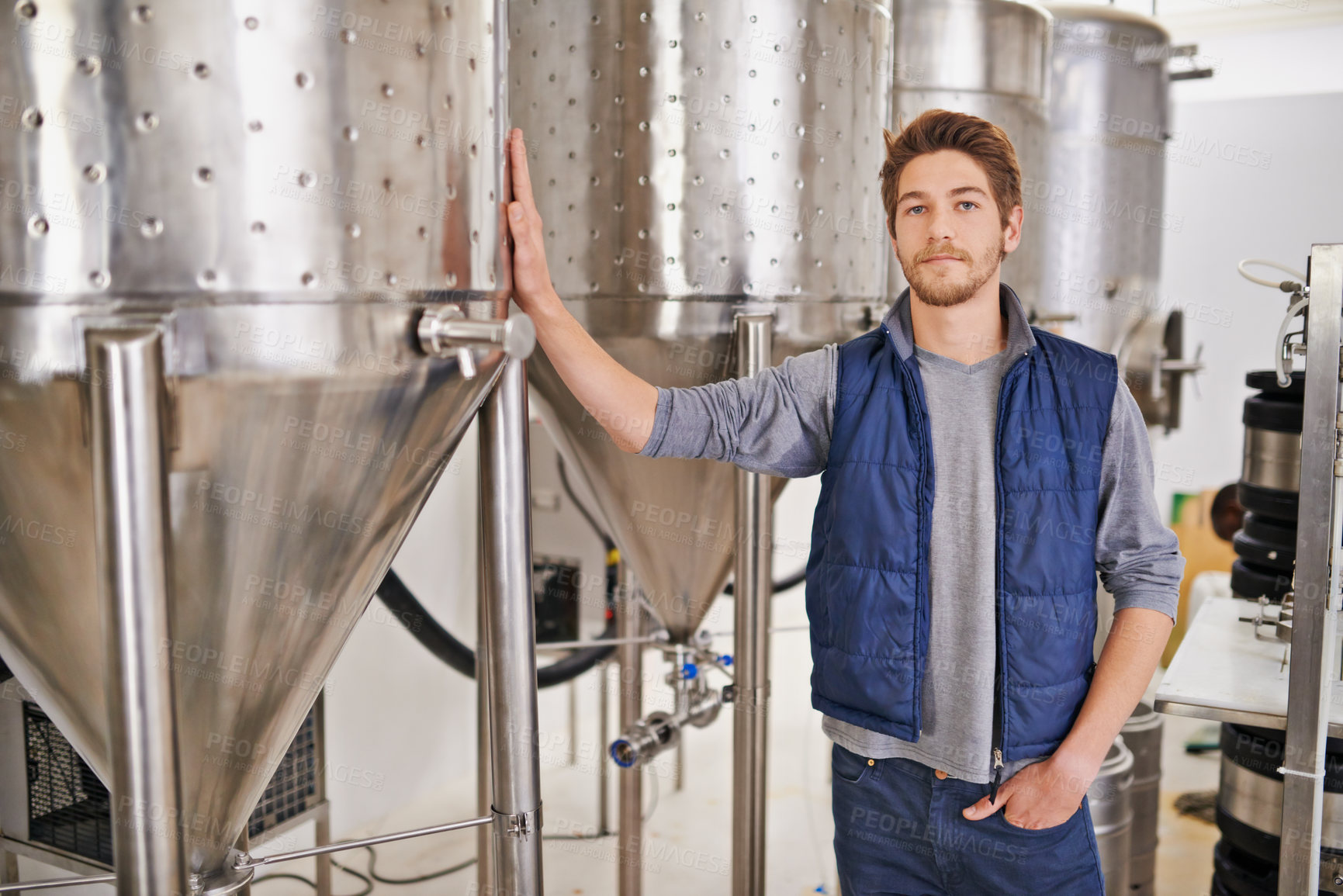 Buy stock photo Brewery, man or manufacturing tank with portrait for craft beer, container or production process in factory. Industrial industry, worker or serious in distillery with machine for brewing in warehouse