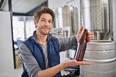 Buy stock photo Shot of a man working in a microbrewery