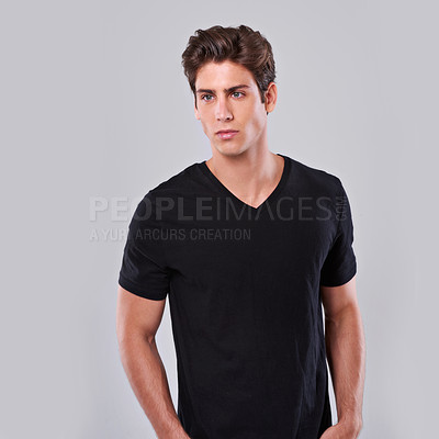 Buy stock photo Studio shot of a young man in a t-shirt