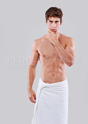 Buy stock photo Towel, skincare and portrait of man on a white background for wellness, hygiene and cleaning for health. Shower, bathroom and isolated confident person for grooming, self care and washing in studio