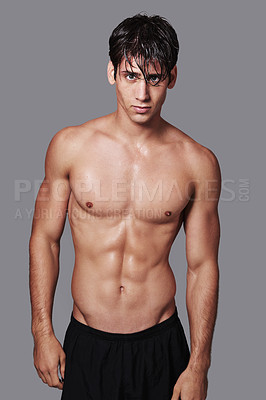 Buy stock photo Man, portrait and muscle confidence in studio for workout routine with stomach abs, grey background or mockup space. Male person, face and model or healthy wellness for hygiene, cleaning or fitness