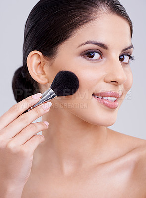 Buy stock photo Woman, portrait and makeup brush in studio for beauty blush, cosmetics or grey background. Female person, facial contour and treatment transformation for makeover wellness, mockup space or routine
