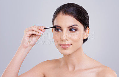 Buy stock photo Makeup, mascara and brush for lashes with woman in studio, beauty and cosmetology on white background. Skin, glow and transformation for makeover, cosmetic product and wand for eyelash with volume
