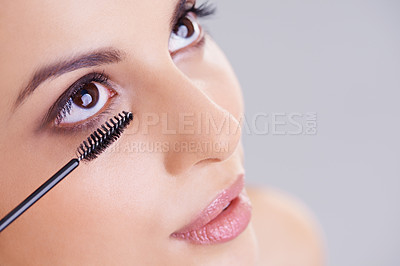 Buy stock photo Eyes, mascara and brush with woman for beauty, lashes and cosmetology on white background. Makeup, glow and transformation for makeover in studio, cosmetic product and wand for eyelash with volume